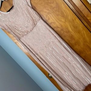 Beautifully beaded, sequined dress.  Worn once, size 12.  Like new condition.